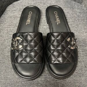 CHANEL Black Quilted Slides with Silver Logo